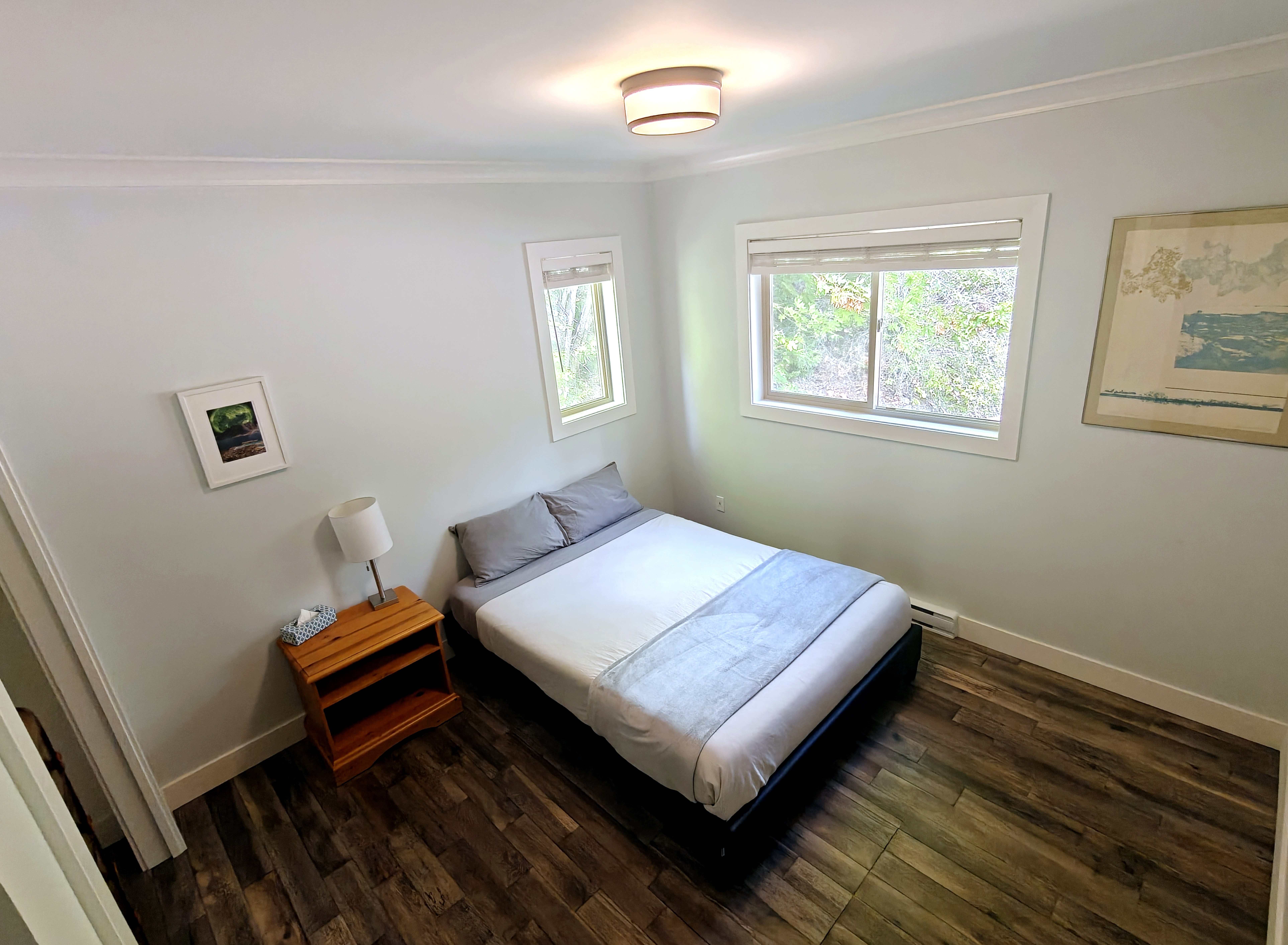 Guest bedroom with forest views